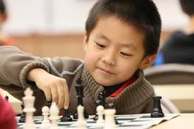 kid playing chess